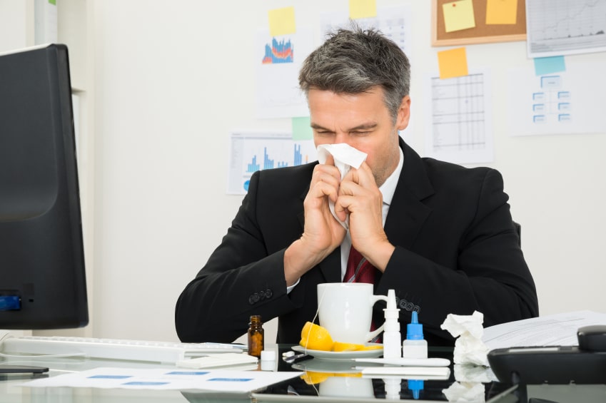 Businessman Blowing His Nose